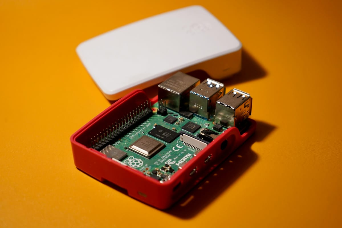 A Raspberry Pi module in an open plastic enclosure